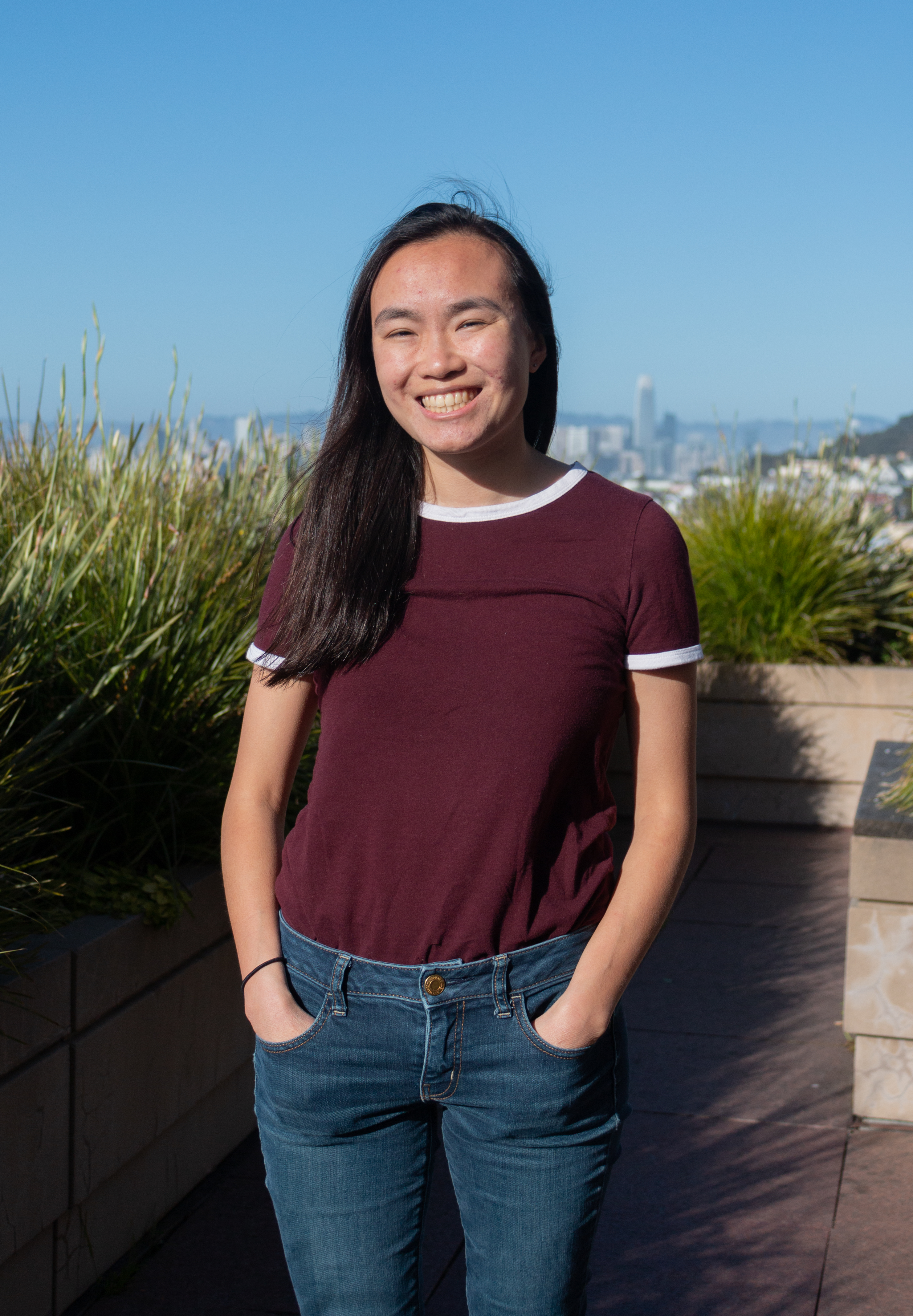 Jackie smiling with city in background